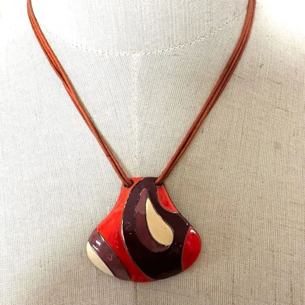 Orange enamel pendant necklace on cord
